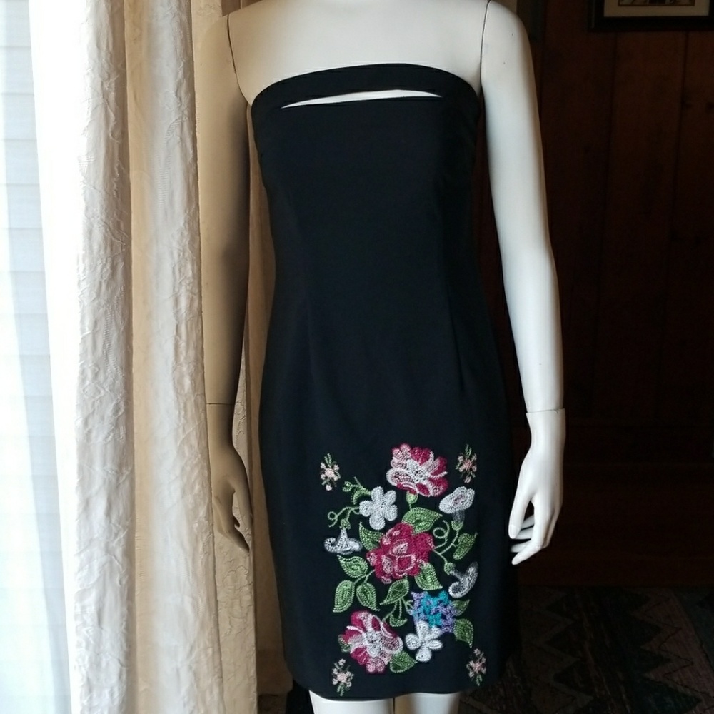 Strapless dress with peekaboo slit at Chest.